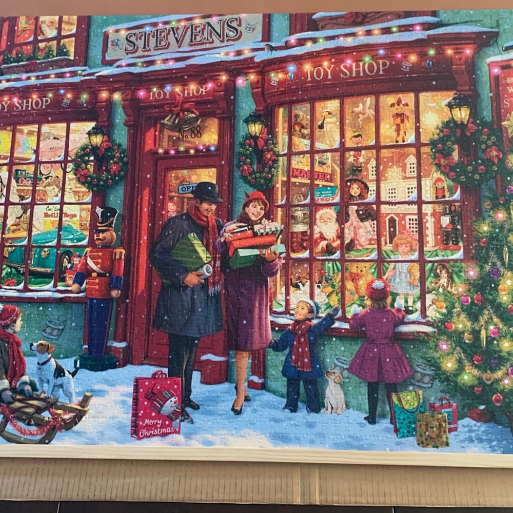 Buffalo Games 2000 piece “Christmas Toy Shop” jigsaw puzzle.
